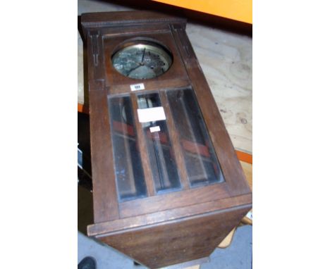An Early 20th Century Oak Wall Clock; having silvered dial with Arabic numerals.