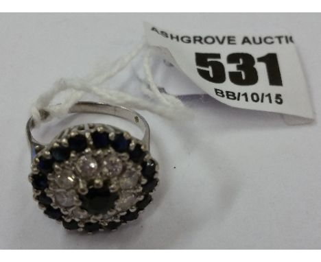 An 18ct Diamond And Sapphire Ring.