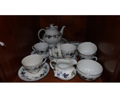 A Complete Royal Doulton 'Burgundy' Pattern Tea Service for Six, with six cups, saucers and side plates, a teapot, milk jug, 