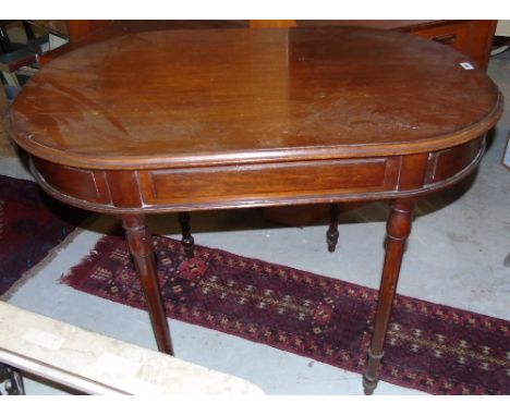 An Early Victorian Mahogany Oval Top Centre Table, standing on tapered ring turned supports.