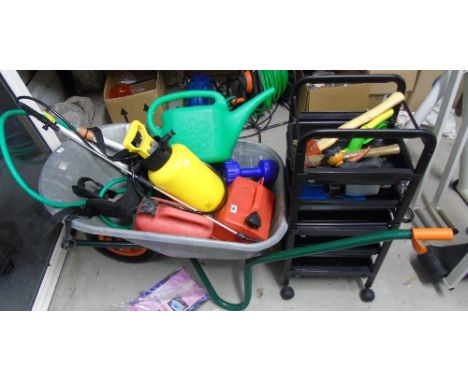 A Large Collection of Gardening Tools to include a wheelbarrow.