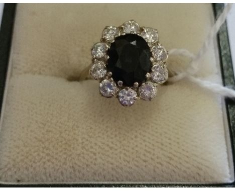 An 18ct White Gold Diamond And Sapphire Ring,  Sapphire 1.5 carat, Diamond 1 carat.