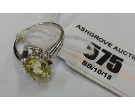 A Silver Ladies Yellow Gem Set Ring. Size K 1/2.