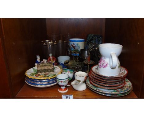 A Large Quantity of Decorative Items on One Shelf.