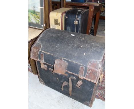 A 19th Century Domed Blanket Chest, along with three vintage cases.