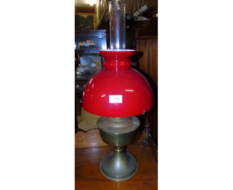 An Early 20th Century Paraffin Lamp with Ruby Shade & Chimney.