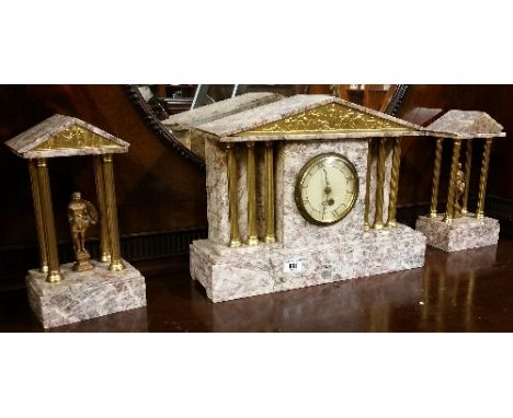 An Early 20th Century Marble Garniture Set; consisting of clock with triple coloured supports along with twin garniture.
