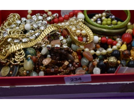 A small selection of costume jewellery including strings of beads and necklaces etc