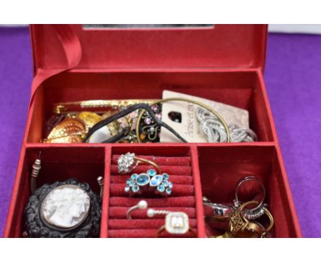 A small jewellery box containing a selection of costume jewellery including cameo brooch, wrist watches, rings etc