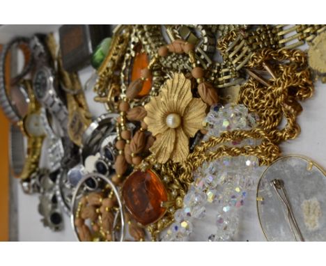 A selection of costume jewellery including fashion watches and brooches etc