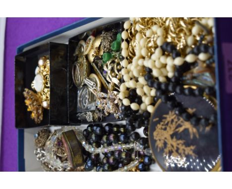 A selection of costume jewellery including a Joan Rivers brooch, Stratton compact etc