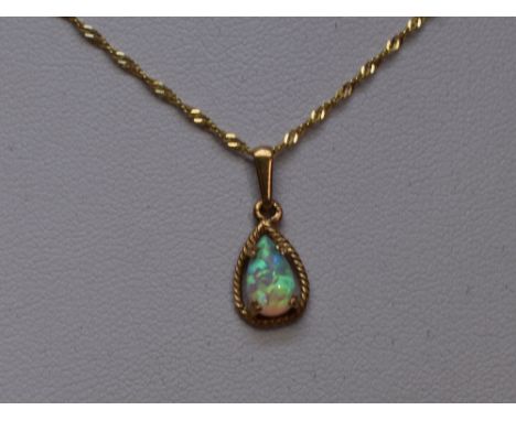 An opal pendant of teardop form in a yellow metal mount on chain stamped 375, approx 16"&nbsp; WEIGHT 1.5G
Condition&nbsp;Rep