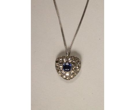 A VICTORIAN SAPPHIRE AND DIAMOND HEART SHAPED PENDANT, the central cushion cut sapphire within a border of twenty three mix c