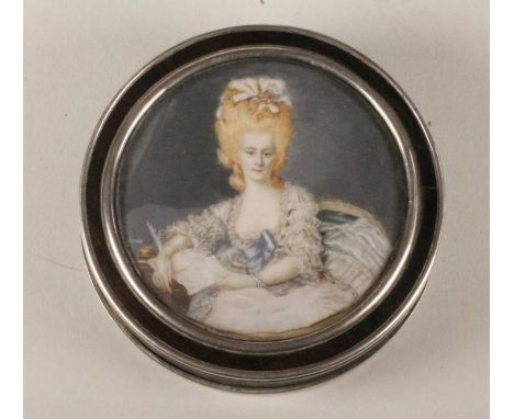 A GEORGIAN EBONY BOX, 18th century, of circular form, lined with tortoiseshell, the cover inset with a miniature painting on 