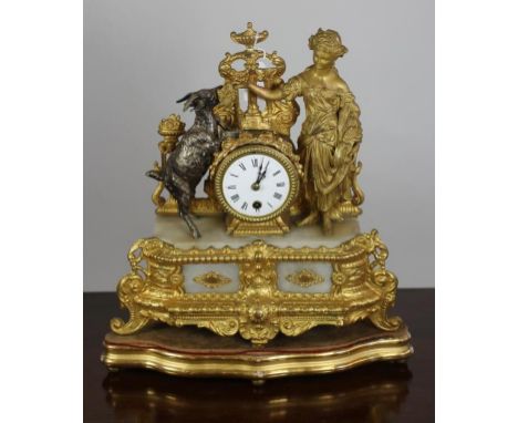 A FRENCH GILT METAL AND ALABASTER TIMEPIECE, late 19th century, the drum movement with 3" enamel dial with Roman numerals, an