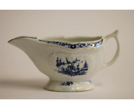 A FIRST PERIOD WORCESTER PORCELAIN SMALL SAUCEBOAT, c.1770, painted in underglaze blue with the "Little Fisherman" pattern, w
