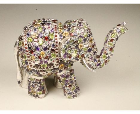 A BEJEWELLED SILVER ELEPHANT POT POURRI, modern, stamped 925, encrusted with amethysts, peridot, garnets, aquamarine, citrine