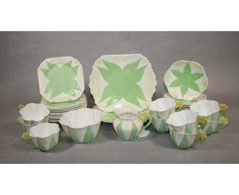 AN ART DECO SHELLEY CHINA "DAINTY" PART TEA SERVICE with green highlighted stiff leaf panels and yellow flower moulded handle