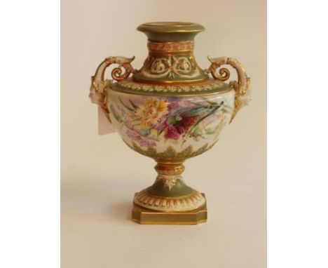 A ROYAL WORCESTER CHINA VASE, 1908, of baluster form on a knopped socle and canted square foot, the two scroll handles with s