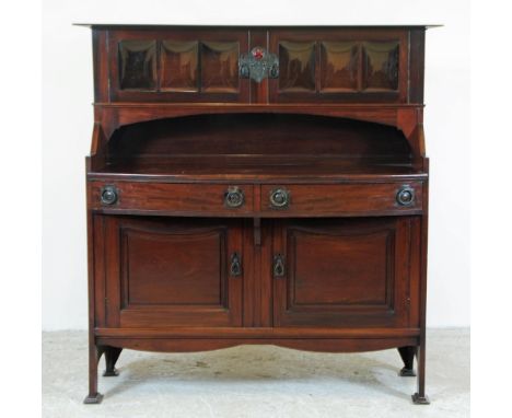 SHAPLAND & PETTER, BARNSTAPLE, An Arts and Crafts Mahogany Sideboard, the raised back with protruding flat top over two shall