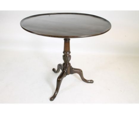 A GEORGIAN MAHOGANY TRIPOD TABLE, late 18th century, the dished circular top on turned vase stem with wrythen collar and bird