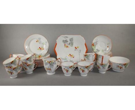 A SHELLEY CHINA TEA SERVICE, 1930's, printed in grey and overpainted in yellow, orange and green with the "Berries" pattern, 