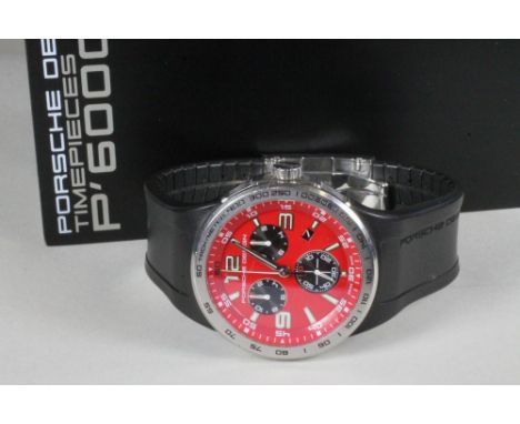 A GENTLEMAN'S STAINLESS STEEL PORSCHE P'6000 CHRONOGRAPH, the circular red dial with applied luminous quarter numerals and li