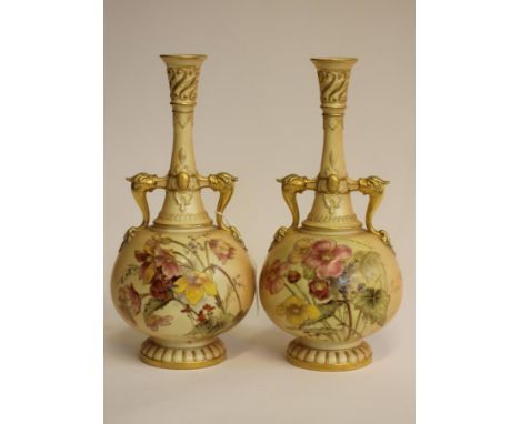 A PAIR OF ROYAL WORCESTER CHINA BOTTLE VASES, 1892, with dolphin handles, painted in polychrome enamels with wayside flowers 