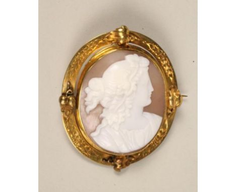 A VICTORIAN CAMEO BROOCH, the oval shell carved with the bust portrait of a young lady wearing a wreath in her curled hair, i