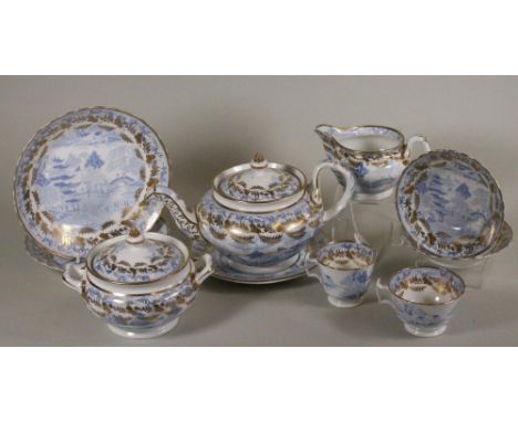 A MILES MASON PORCELAIN PART TEA AND COFFEE SERVICE, c.1810, printed in underglaze blue with the Willow pattern, the borders 