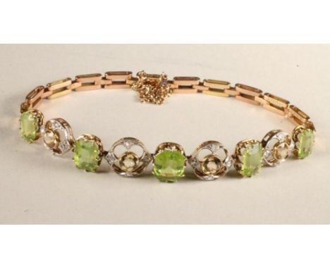 AN EDWARDIAN PERIDOT, CITRINE AND DIAMOND BRACELET, the upper section claw set with five step cut peridot interspersed with f