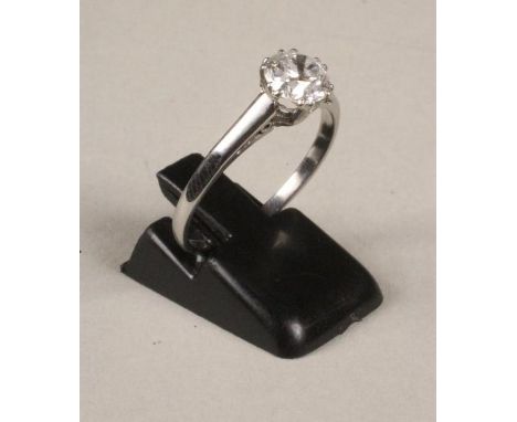 A SOLITAIRE DIAMOND RING, the brilliant cut stone of approximately 1ct, claw set to a platinum shank, size R (Illustrated)