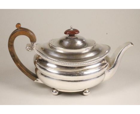 A LATE GEORGE III SILVER TEAPOT, makers Barber & Whitwell, York 1821, of bombe oval form with downswept shoulders, flat hinge