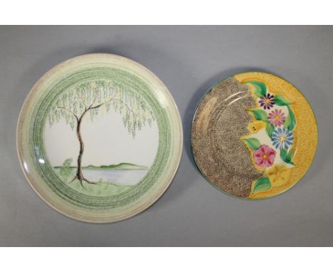 A CLARICE CLIFF WILKINSON POTTERY BIZARRE PLATE, 1930's, of plain dished circular form, with "crayon" lake landscape with a l