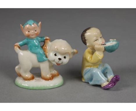 A SHELLEY MABEL LUCIE ATTWELL CHINA FIGURE, 1930's, of a Boo-Boo in a turquoise hat and suit seated astride a dog, printed ma