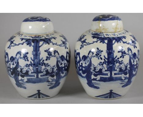 A PAIR OF CHINESE PORCELAIN JARS AND COVERS of ovoid form, painted in underglaze blue with two children playing beside their 
