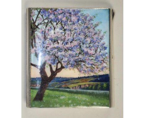 AN ART DECO CIGARETTE CASE, London import marks 1928, of plain oblong form, the guilloche enamelled fascia painted in colours