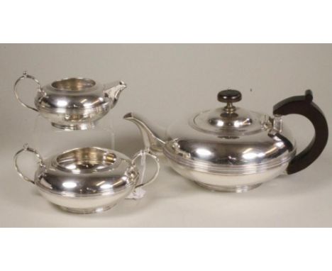 A COMPOSITE THREE PIECE SILVER TEA SERVICE, makers Fordham & Faukener, Sheffield 1912 and 1916 (teapot), of single girdled sq