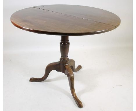 A GEORGIAN MAHOGANY TRIPOD TABLE, late 18th century, the circular tip up top on turned vase shaped stem, tripod base with cab