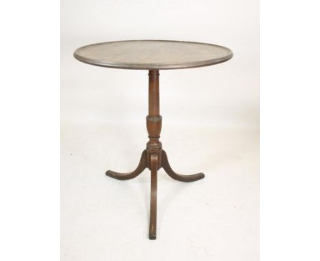 A GEORGIAN MAHOGANY TRIPOD TABLE, late 18th century, the dished circular top with moulded edge, turned vase shaped stem, on d