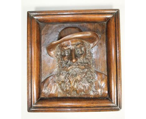 WILLIAM FELL OF WINDERMERE (? - 1915), Self Portrait, head and shoulders, oak panel carved in high relief within a moulded oa