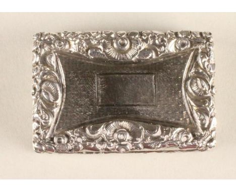 A WILLIAM IV SILVER VINAIGRETTE, maker John Betteridge, Birmingham 1831, of oblong form with heavily chased and applied folia