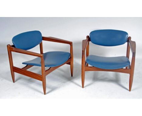 ARTHUR EDWARDS, a pair of Crannac armchairs in teak and blue leather with curved padded back, shaped arms, dished seat and tu