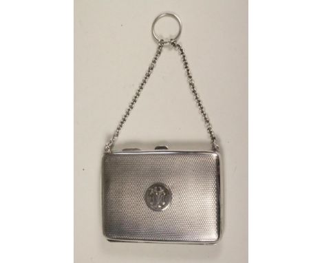 A LADY'S SILVER CASE/AIDE MEMOIRE, maker's mark D. Bros., Birmingham 1919, of plain rounded oblong form with all over engine 