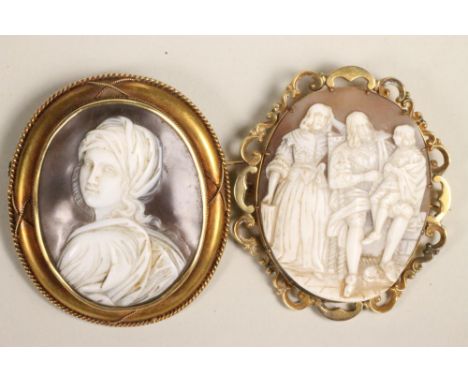 TWO VICTORIAN OVAL SHELL CAMEO BROOCHES, one depicting King Charles I with his Queen and son, 2" x 1 3/4" in a scroll mount, 