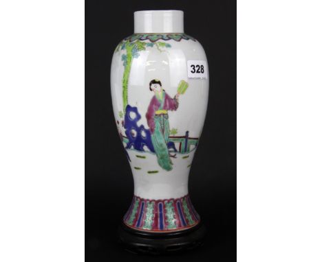 A Chinese early to mid 20th century hand enamelled porcelain vase on carved wooden stand, overall H. 29cm.