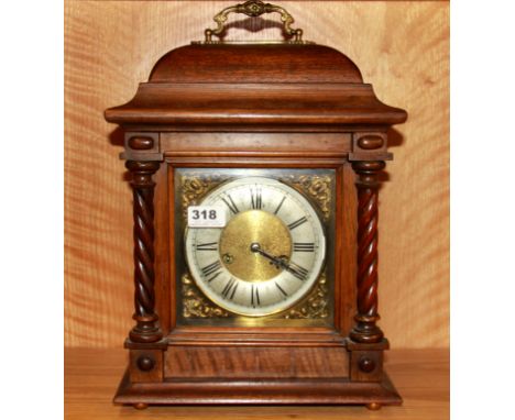 An oak bracket clock, H. 43cm.