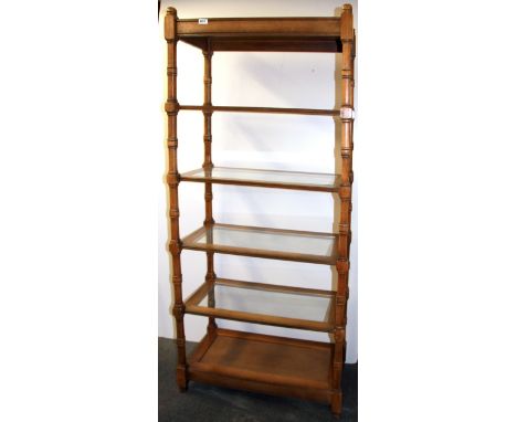 A useful wood and glass display stand, W. 76cm H. 183cm.