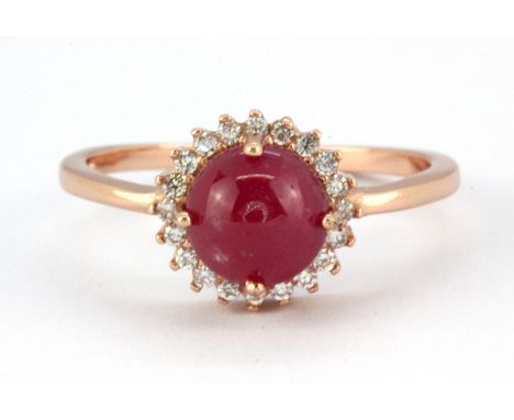 A 925 silver rose gold gilt ring set with a cabochon cut ruby and white stones, (O).