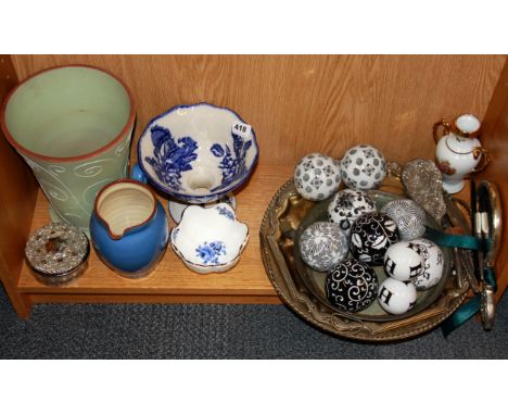 A collection of ceramic carpet bowls and other items.